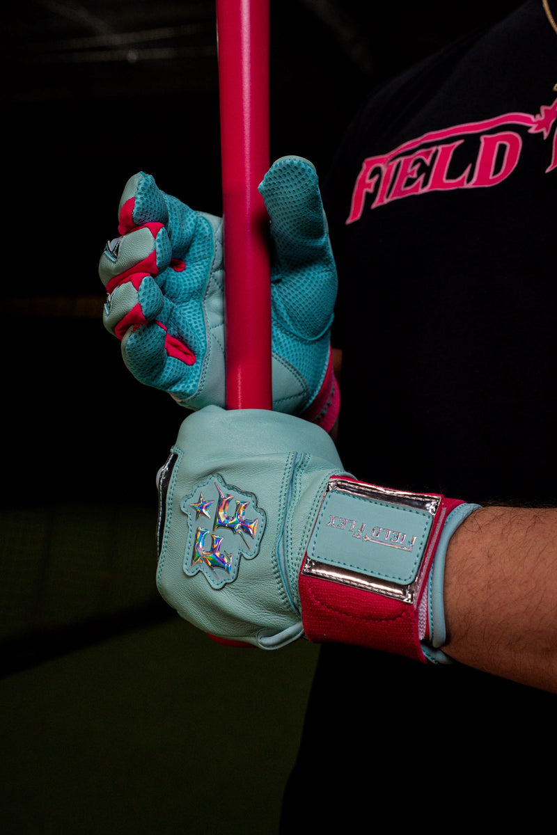Baseball player wearing Field Flex mint and hot pink goat leather batting gloves